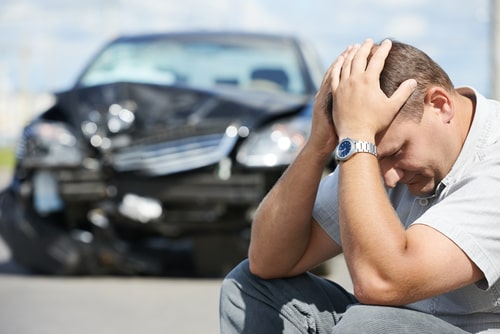 man distraught after car accident